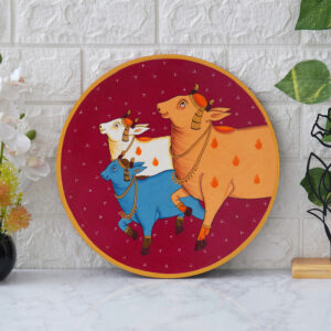 Crafted on a wooden plate, this pichwai portrays three cows in a circular formation.