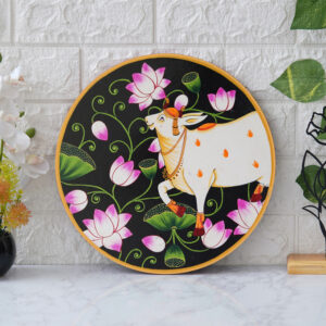 This beautiful pichwai painting features a serene white cow adorned with a vibrant floral headdress.